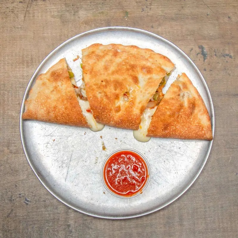 Golden baked stromboli with a side of marinara