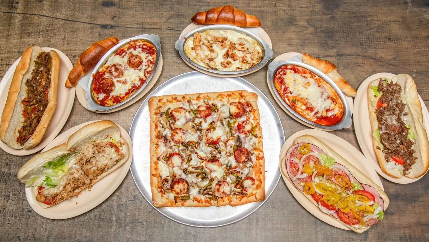 Sicilian square pizza, cheese pizza, steak and cheese subs and stromboli from Tiano's Pizza in Madison, NC